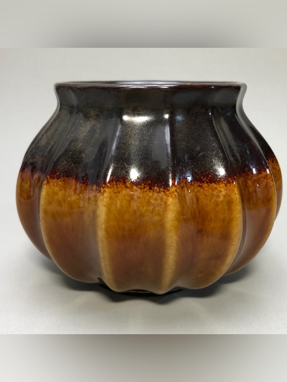 Vintage, “pumpkin” shape ceramic candle holder, glossy drip glaze
